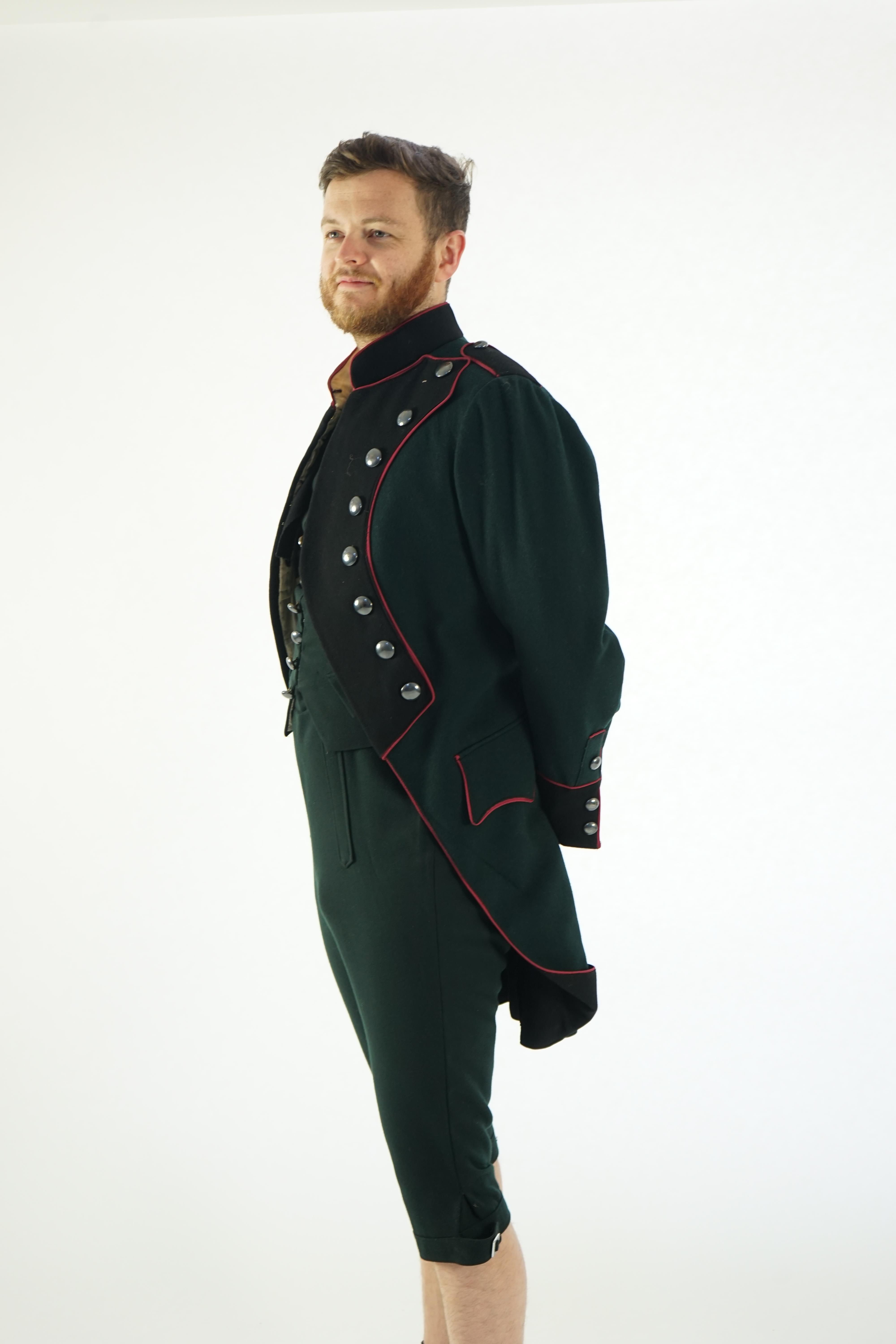 A dark green and black 18th Century style military uniform (jacket, waistcoat and breeches). Ex Royal Opera House - Soldier 'The Barber of Seville' 1993